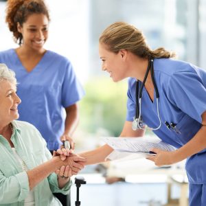 Shot,Of,An,Attractive,Female,Nurse,Holding,Medical,Records,While